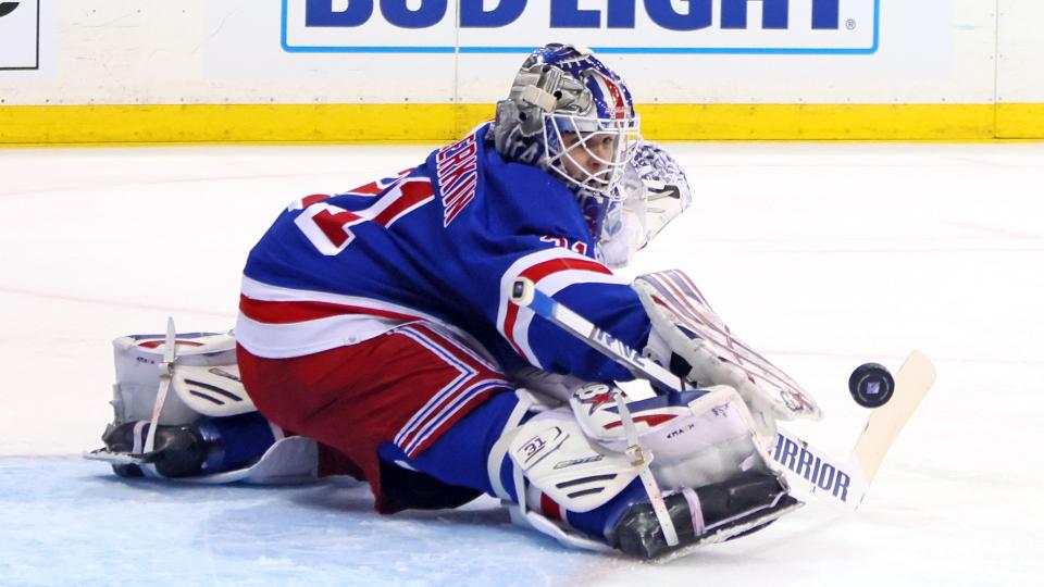 Igor Shesterkin of the New York Rangers stretches during the game